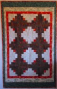 Large log cabin with orange centers-20 quilts 10-14-19